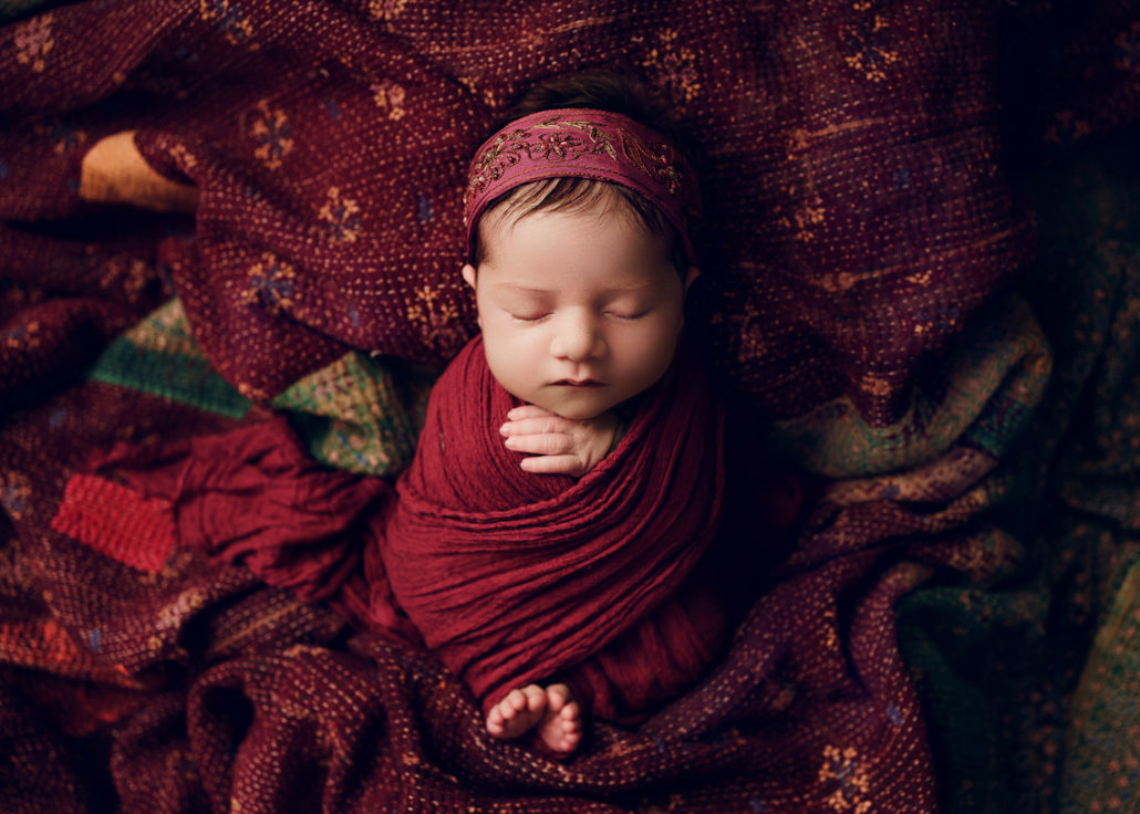sari silk wrapped newborn baby in photoshoot grimsby